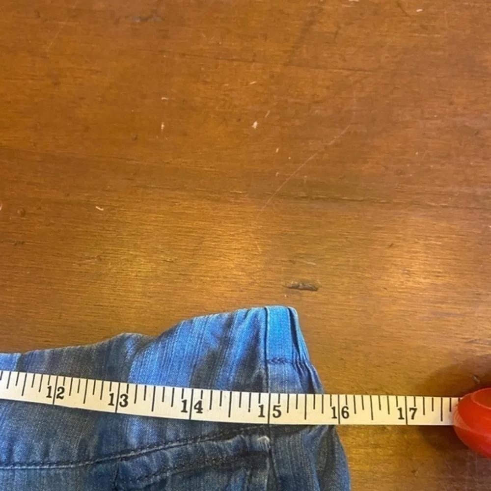 Woman’s chambray size‎ large with ruffle, short skirt